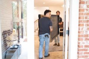 Sectional being safely removed from a home